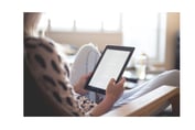 A person reads on an e-reader