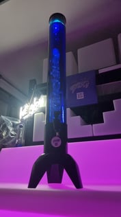 Blue glowing drink tower with ice cube tube, on a pink glow bar with lets glow neon behind in Redlands.