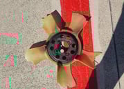 Broken cooling fan on ground