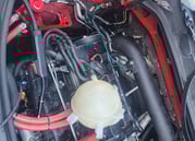Battery wires inside engine compartment