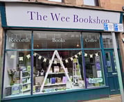 a store front window of a book store on Kempock Street in Gourock