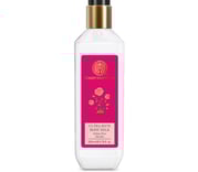 a bottle of body lotion with a pink rose on it