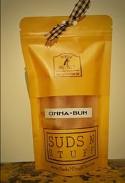 a rustic bag of wax melts. The label says 'cinnamon bun wax melts'.