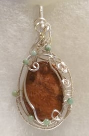 silver wire wrapped orange fossilized coral 