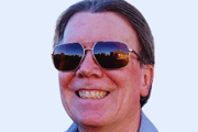 a man wearing sunglasses and sunglasses with a tie