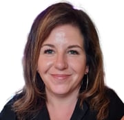 a woman with a black shirt and earrings
