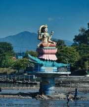 a statue of a woman sitting on a pedestal