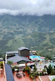 a view of a mountain range with a pool