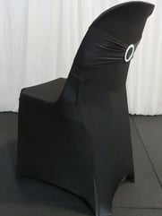 Pipee plastic event chairs with black spandex covers for hire in Redlands.