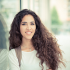 a woman with long hair and a backpack