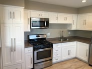 huntington beach apartment remodeled kitchen with stainless steel appliances