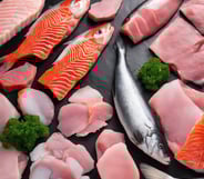 turned on MacBook Pro beside gray mug