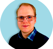 a man with glasses and a blue shirt