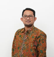 a man in a floral shirt and glasses