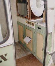 a small kitchen with a microwave and a microwave