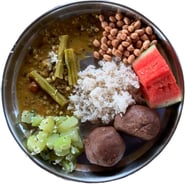 a plate of food with rice, beans, and vegetables showing Yogic food
