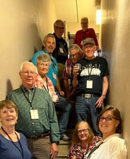 10 telelaget members stand in a stairwell