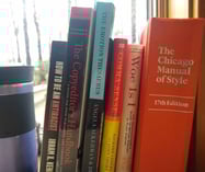 Coffee cup and windowsill of books about writing and editing