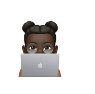 a person sitting at a desk with a laptop