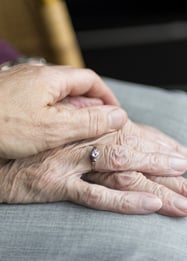 a woman holding a ring on her finger