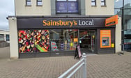 a store front of a store with a sign that says sainsburys local Kempock Street in Gourock