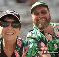 Chrissie and Danny portrait shot in Hawaiian shirts.