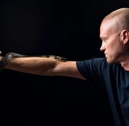 a man holding a snake