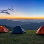 Mountain camping at sunrise in the Dominican Republic with scenic valley views