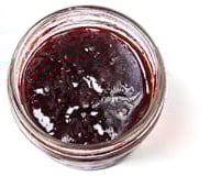 A little container of red raspberry jam