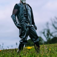 FTSH Studios model (s) Oscar Thickk UK Fetish Model wearing farmerrain bodysuit, gloves, gas mask, chains