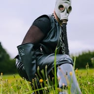 FTSH Studios model (s) Oscar Thickk UK Fetish Model wearing farmerrain bodysuit, gloves, gas mask, chains