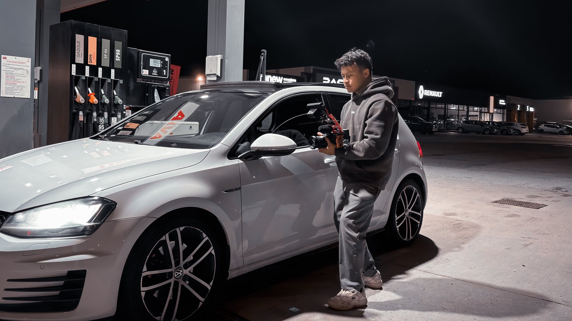 woman sitting on armless chair with light between bookcases in room
