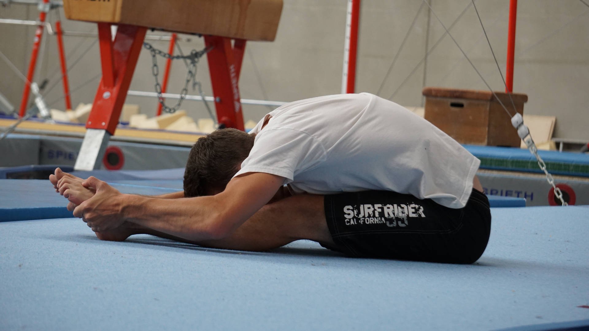 an abstract photo of a curved building with a blue sky in the background