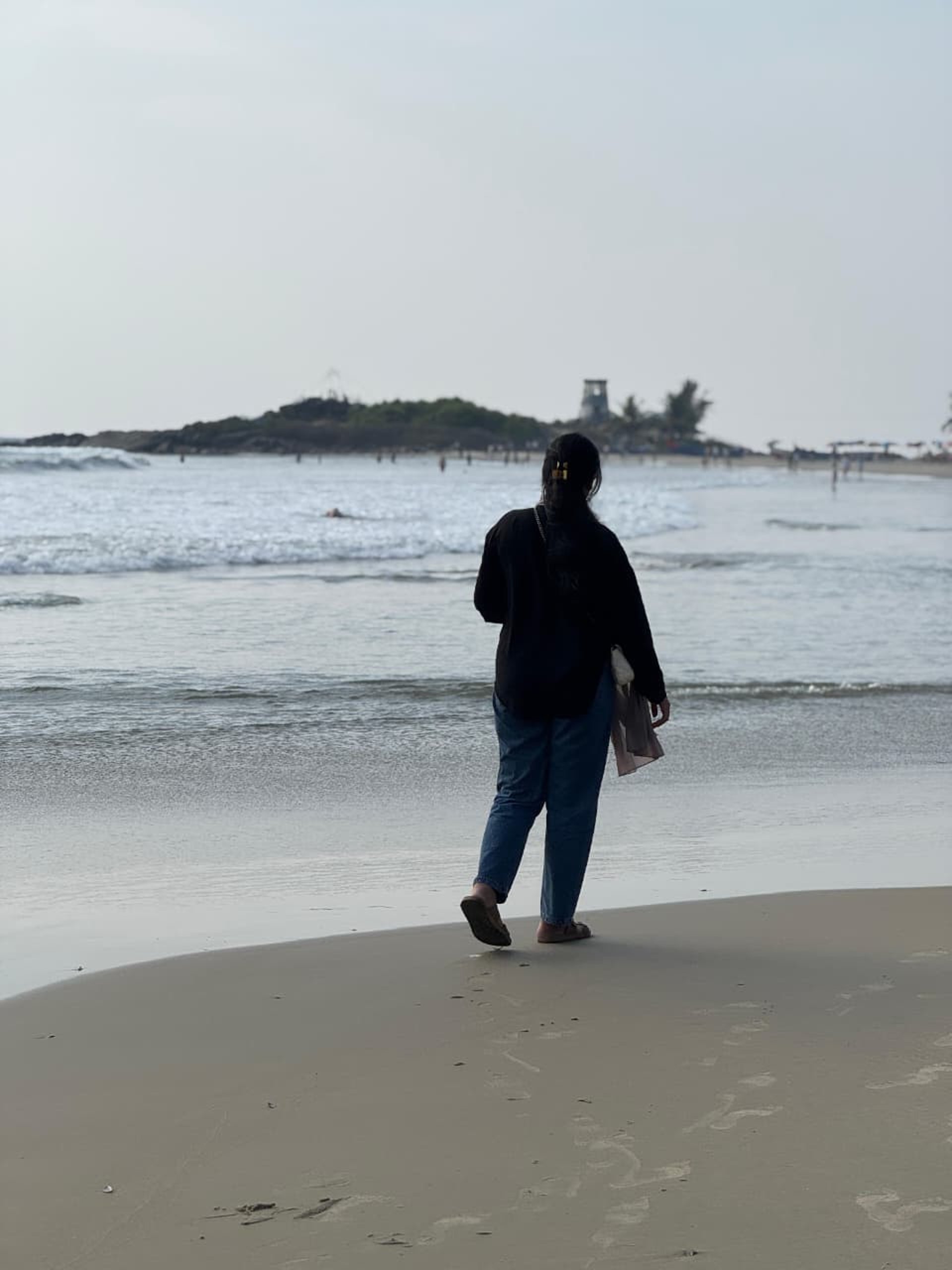 an abstract photo of a curved building with a blue sky in the background