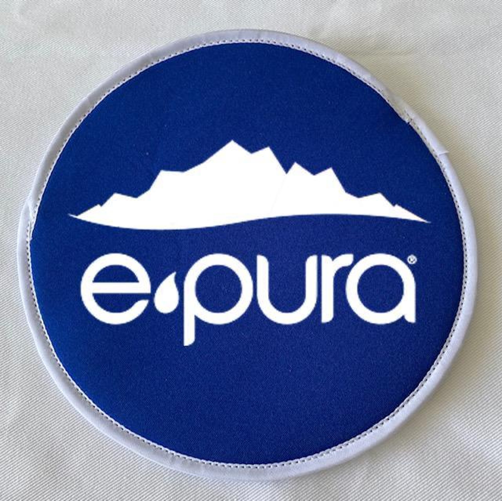 the back of a woman's backpack with a logo on it