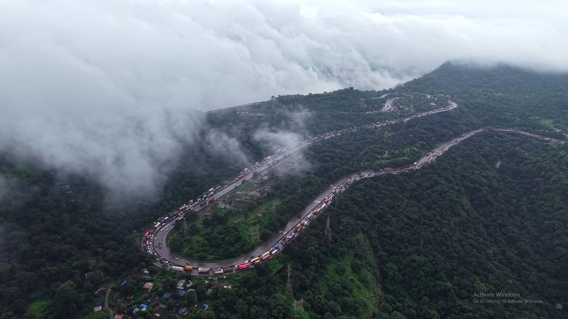 A man sanding a wooden table with a sander