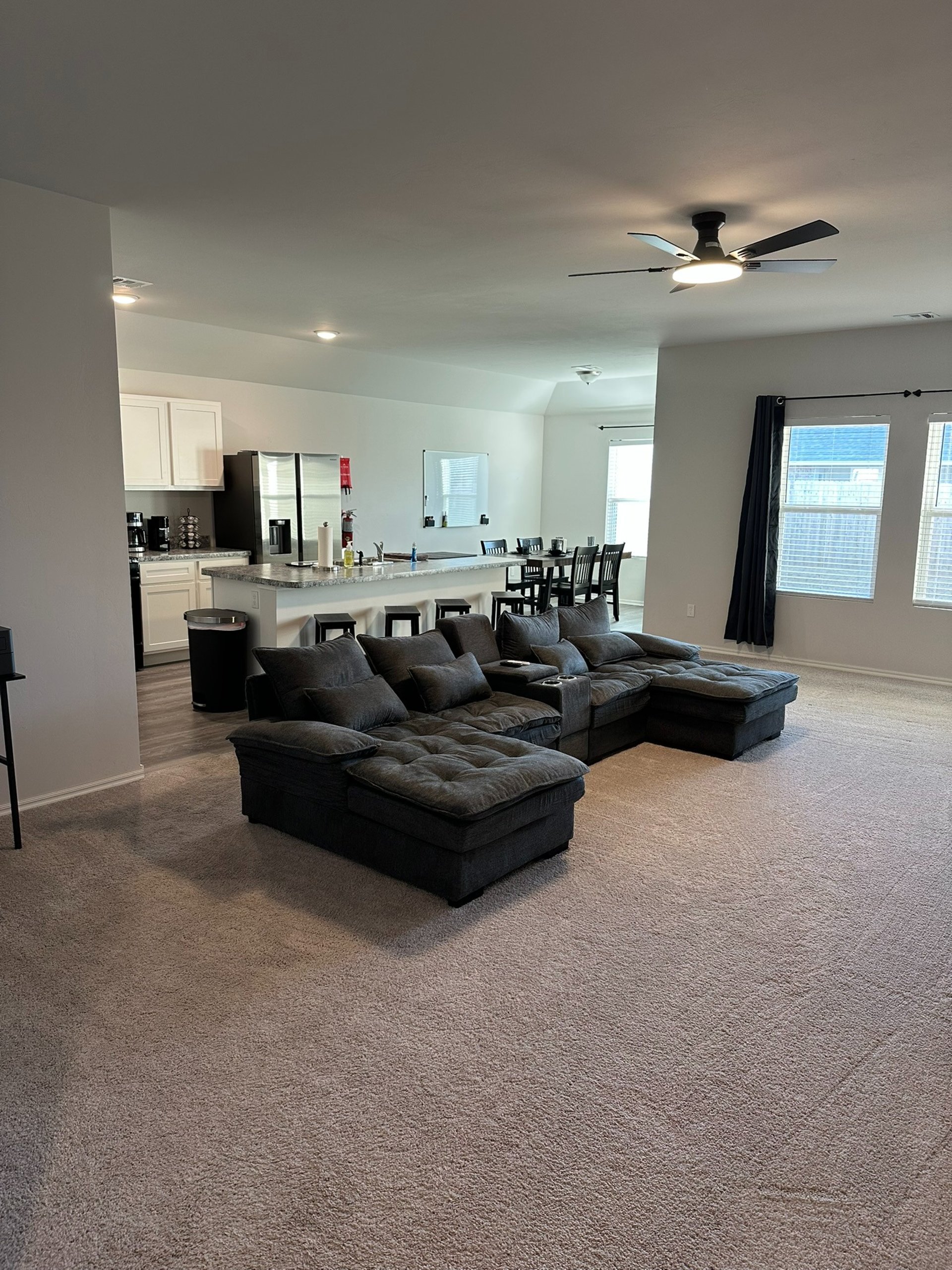 black and brown leather padded tub sofa