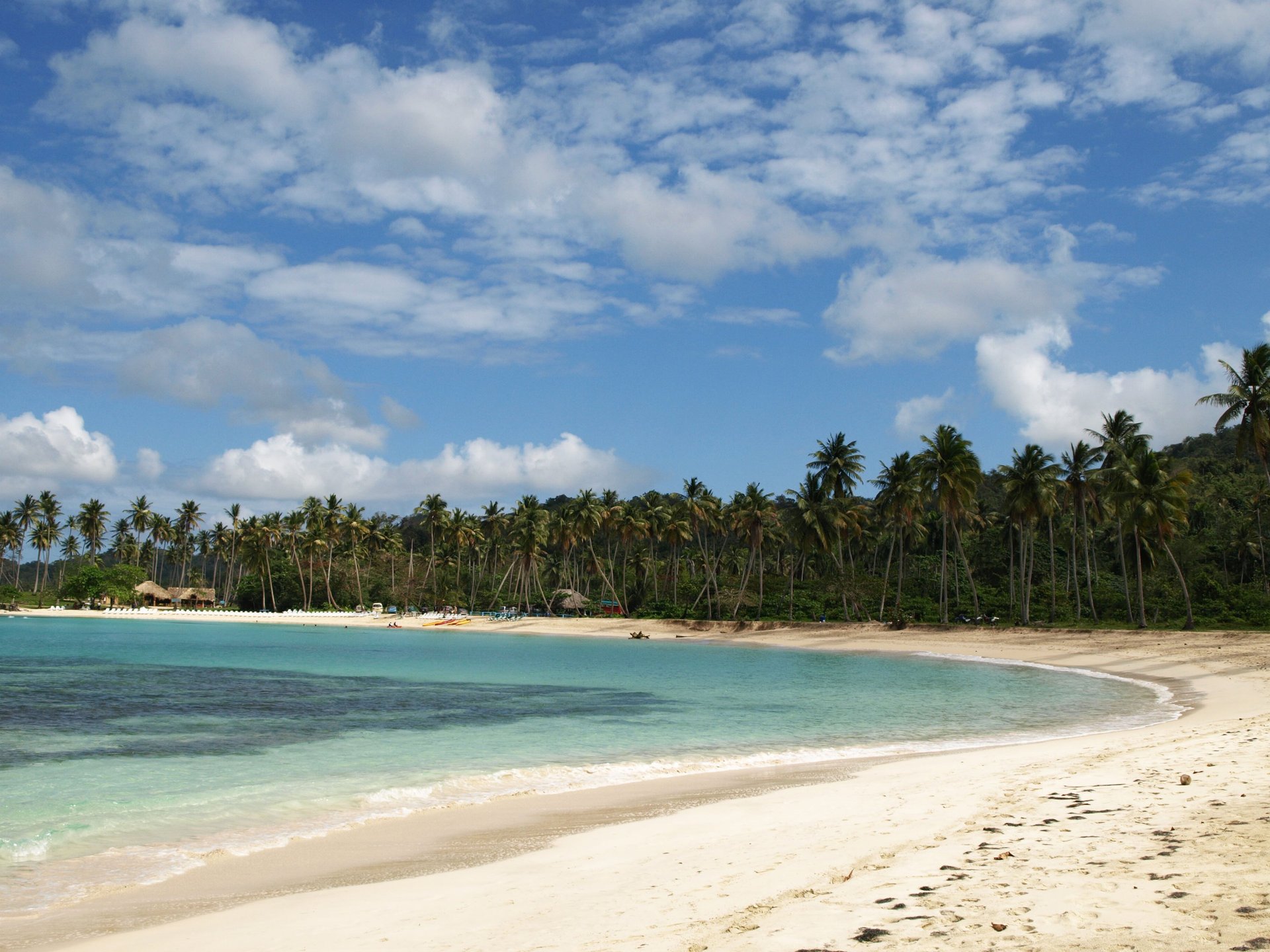 an abstract photo of a curved building with a blue sky in the background