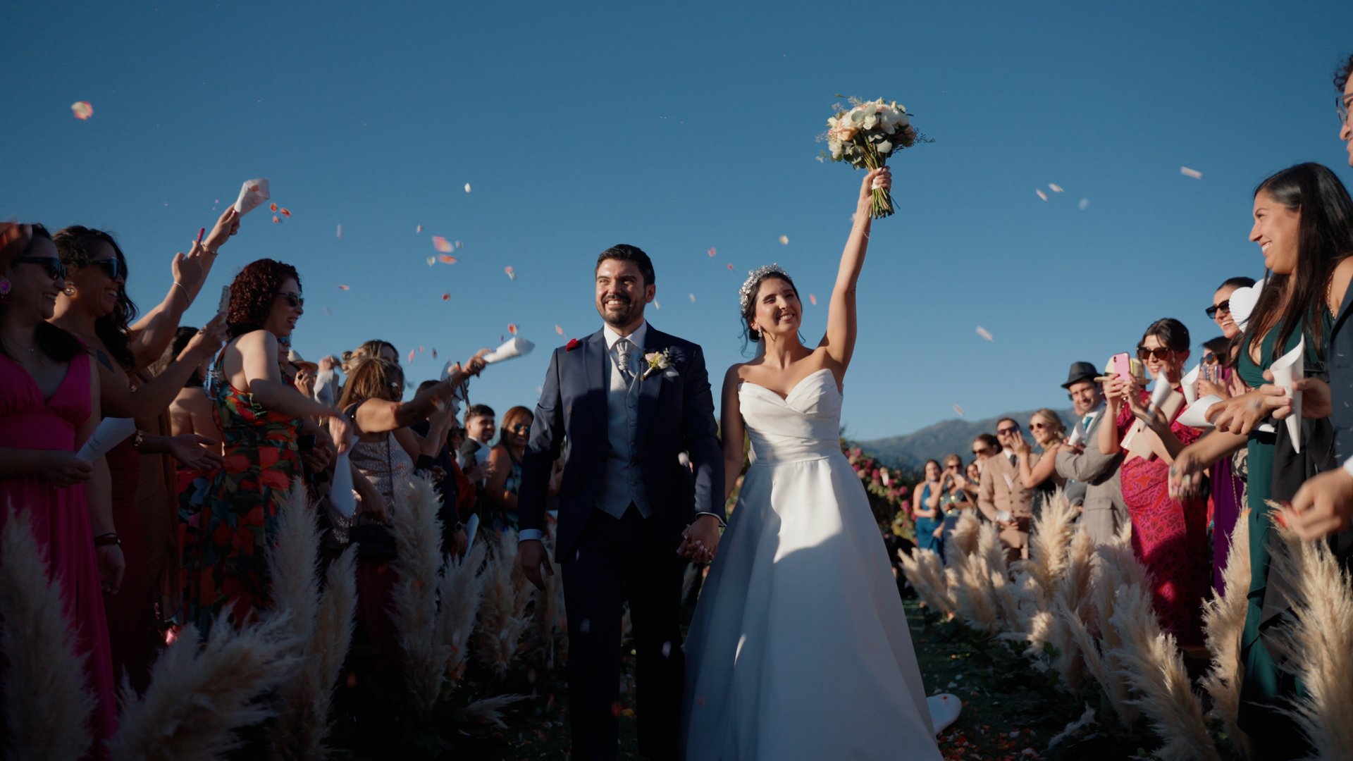 A man holding a woman in the middle of a field