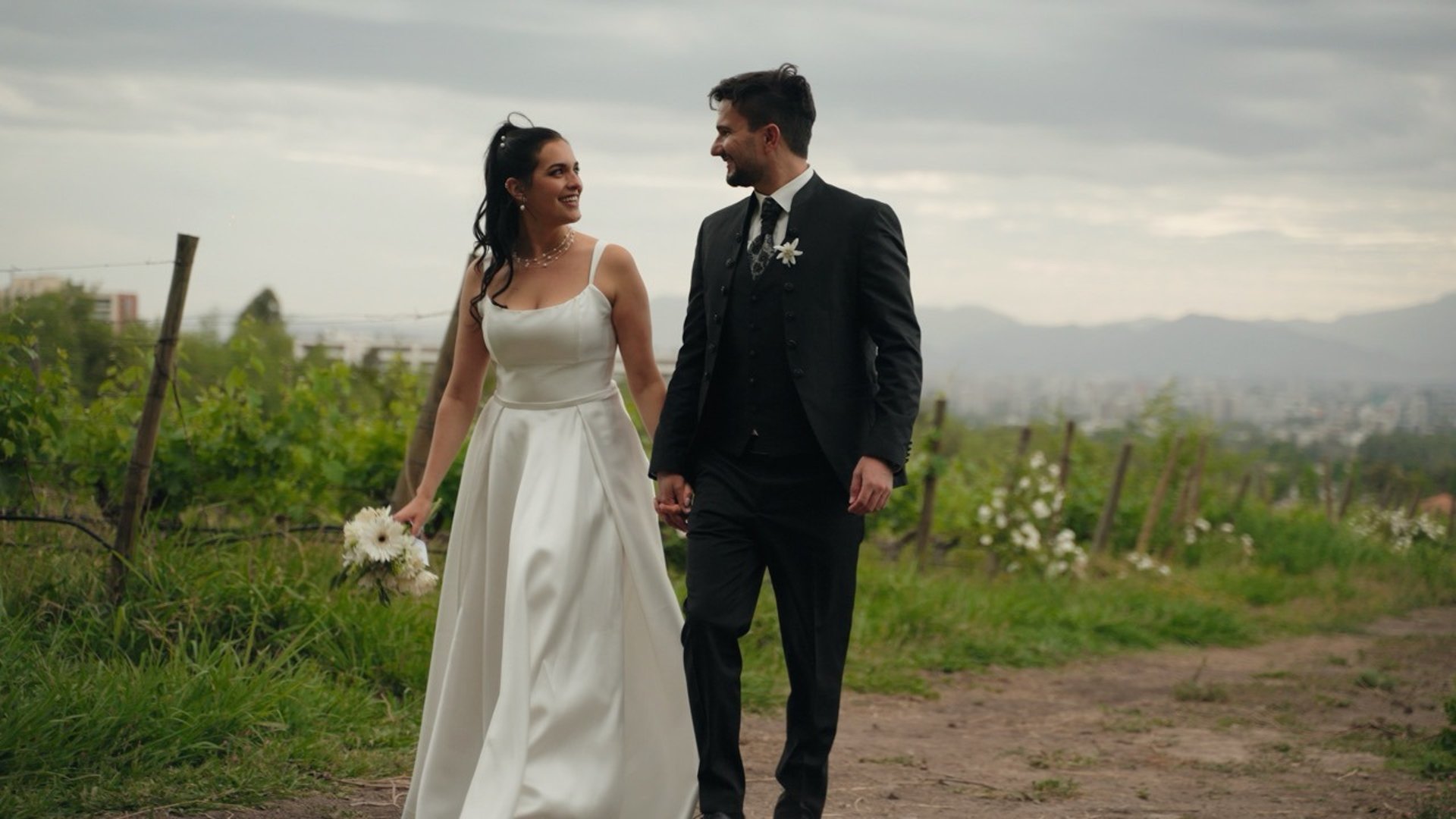 A man and a woman standing in a field