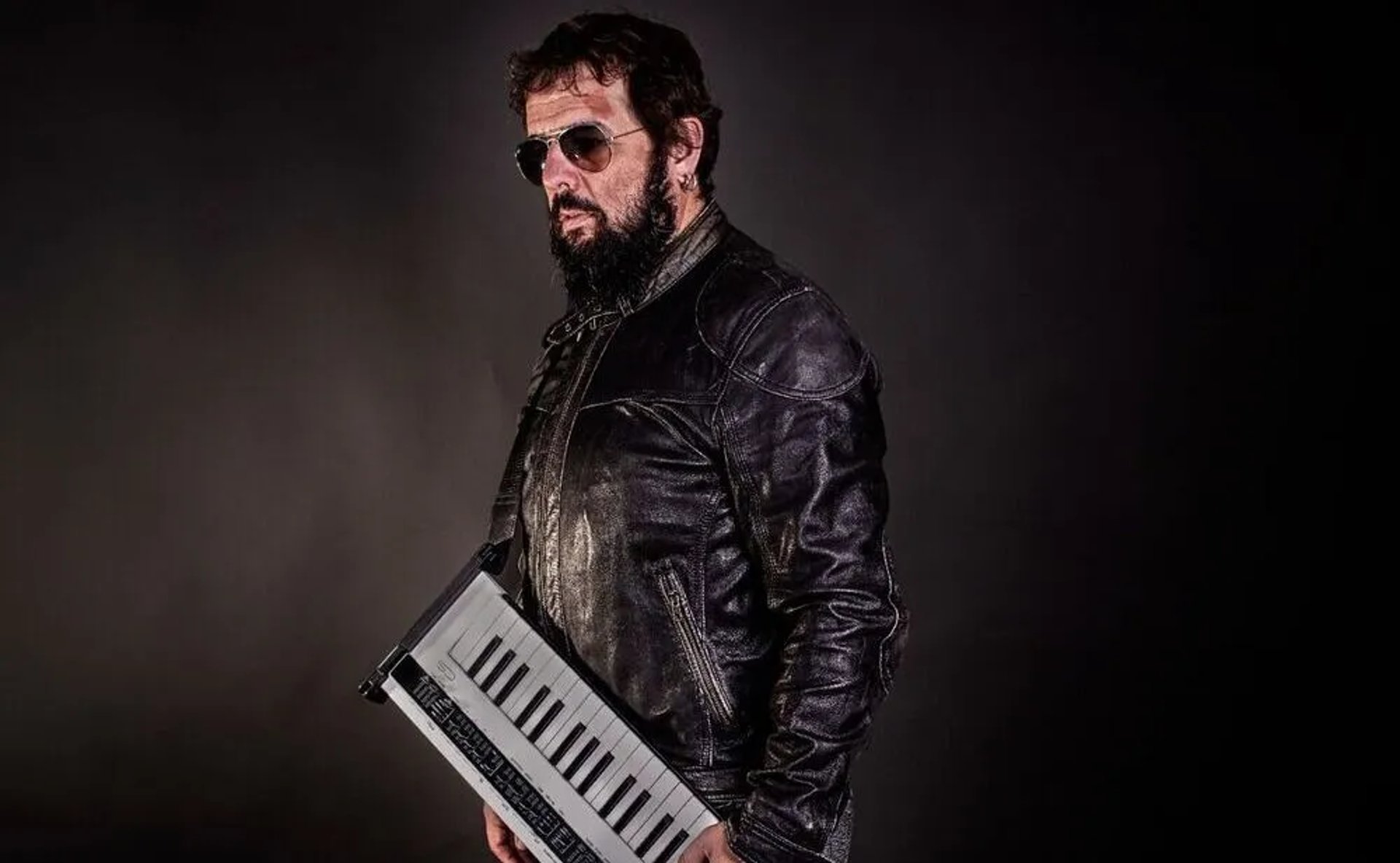 an abstract photo of a curved building with a blue sky in the background
