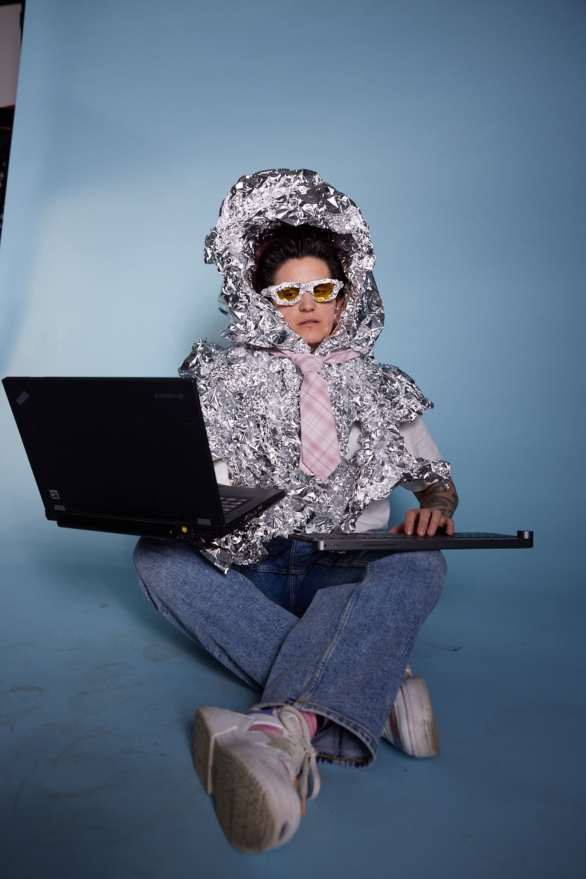 person wearing grey knit sweater