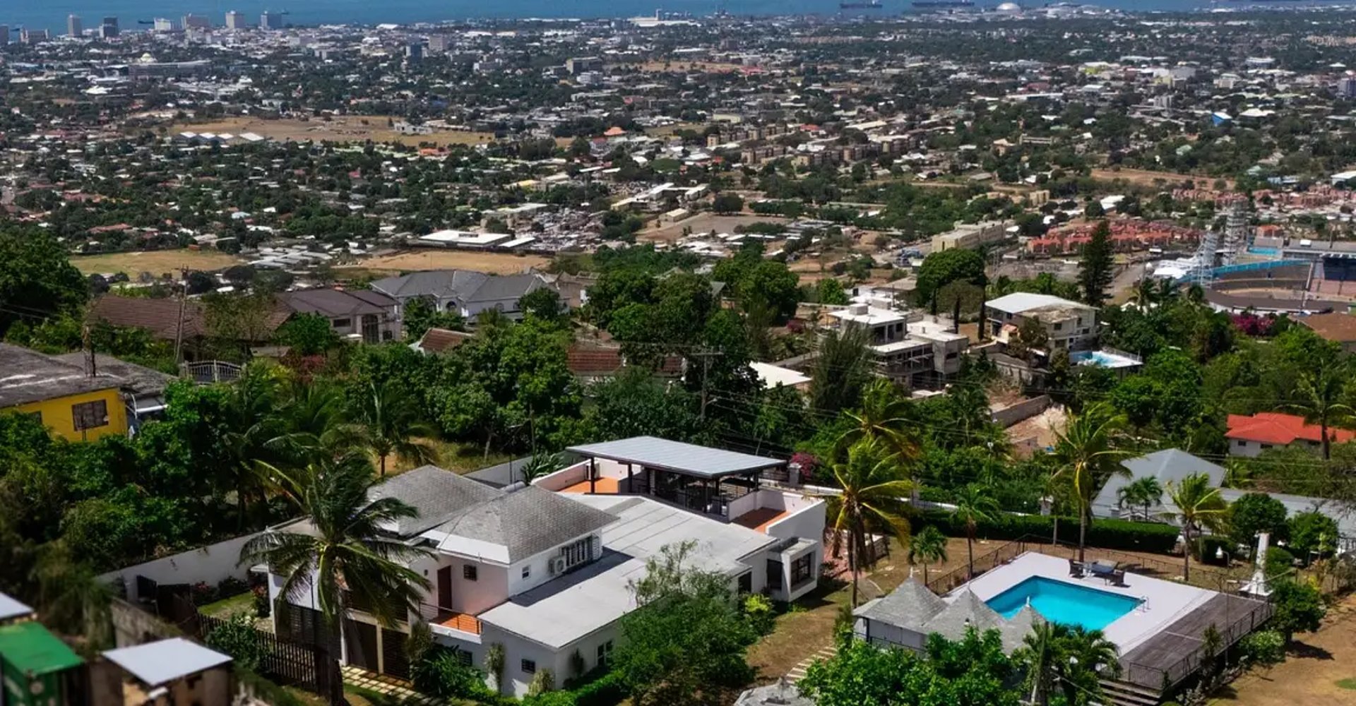 woman wearing yellow long-sleeved dress under white clouds and blue sky during daytime