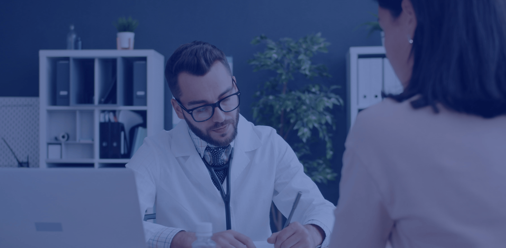 an abstract photo of a curved building with a blue sky in the background