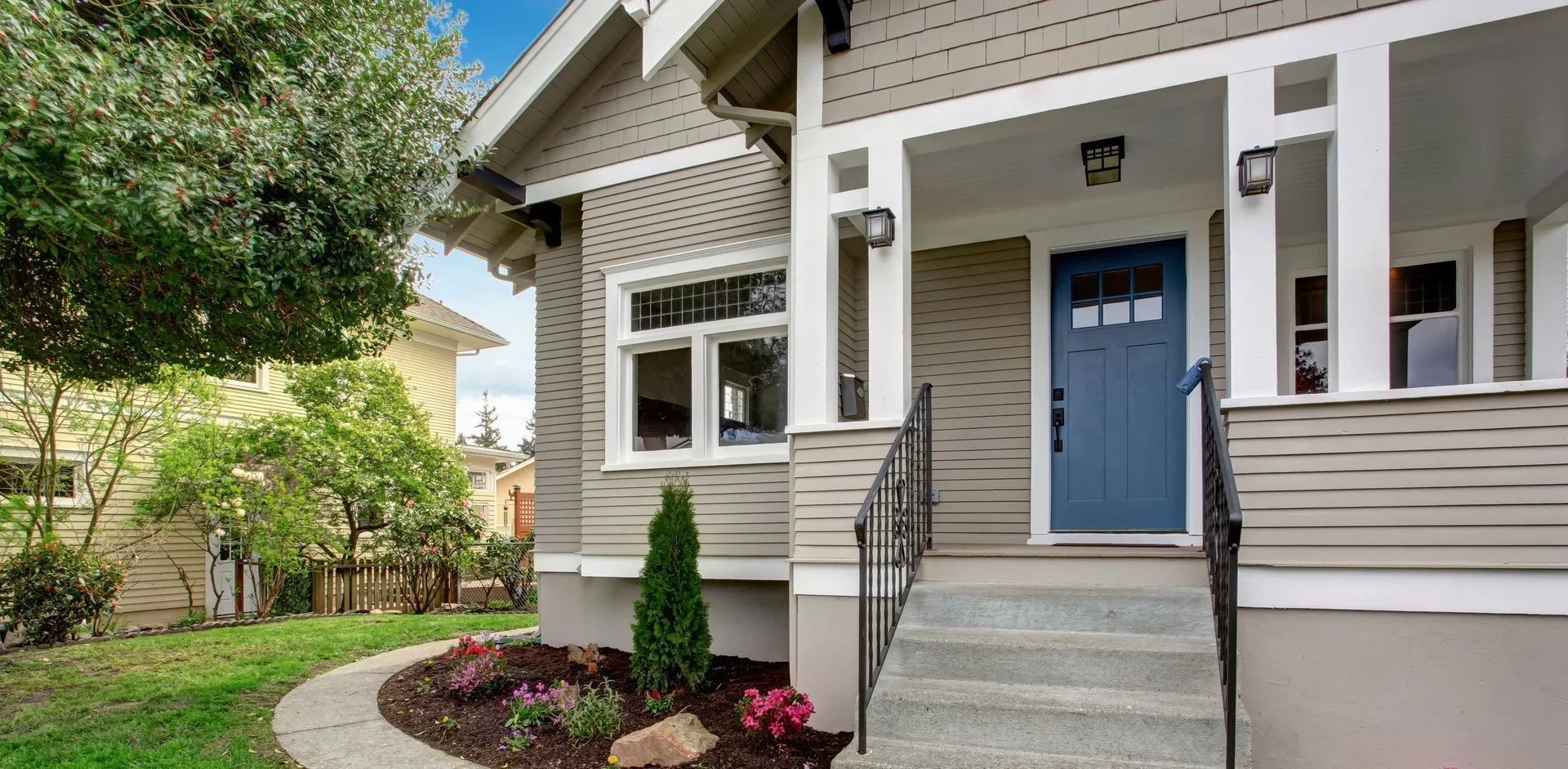 an abstract photo of a curved building with a blue sky in the background