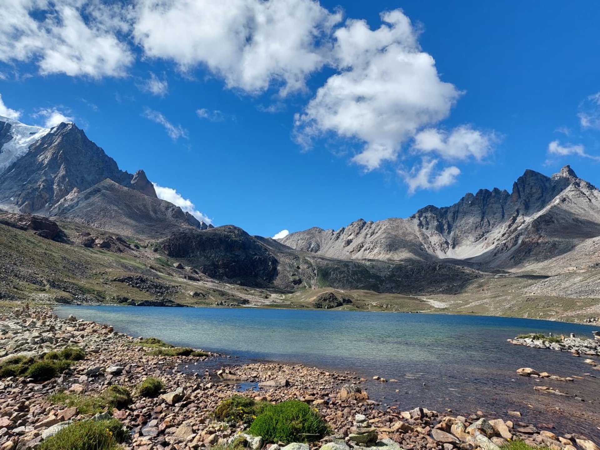 woman wearing yellow long-sleeved dress under white clouds and blue sky during daytime