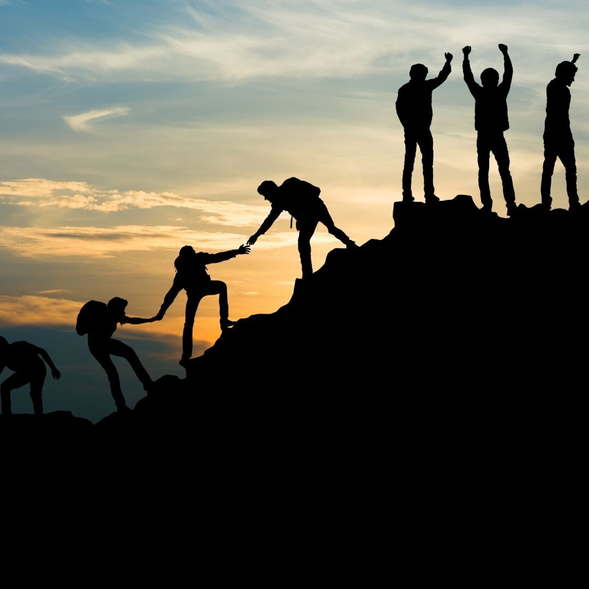 silhouette photo of group of people on mountain