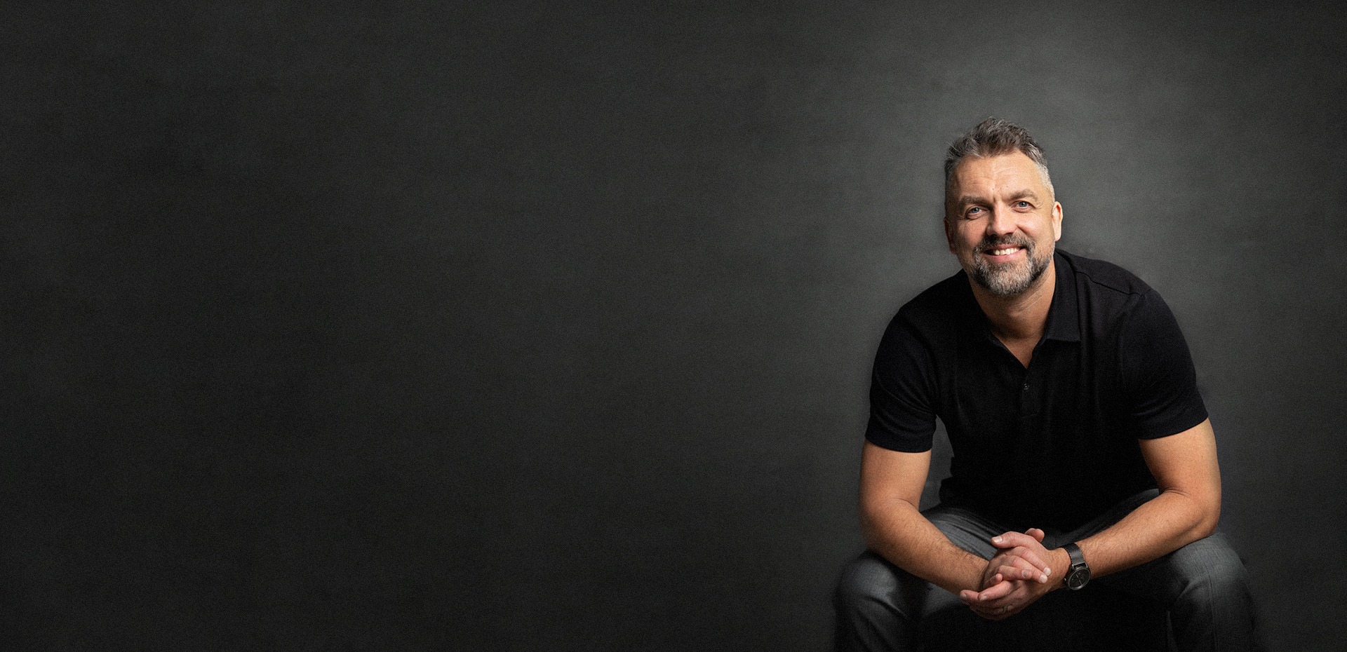 an abstract photo of a curved building with a blue sky in the background