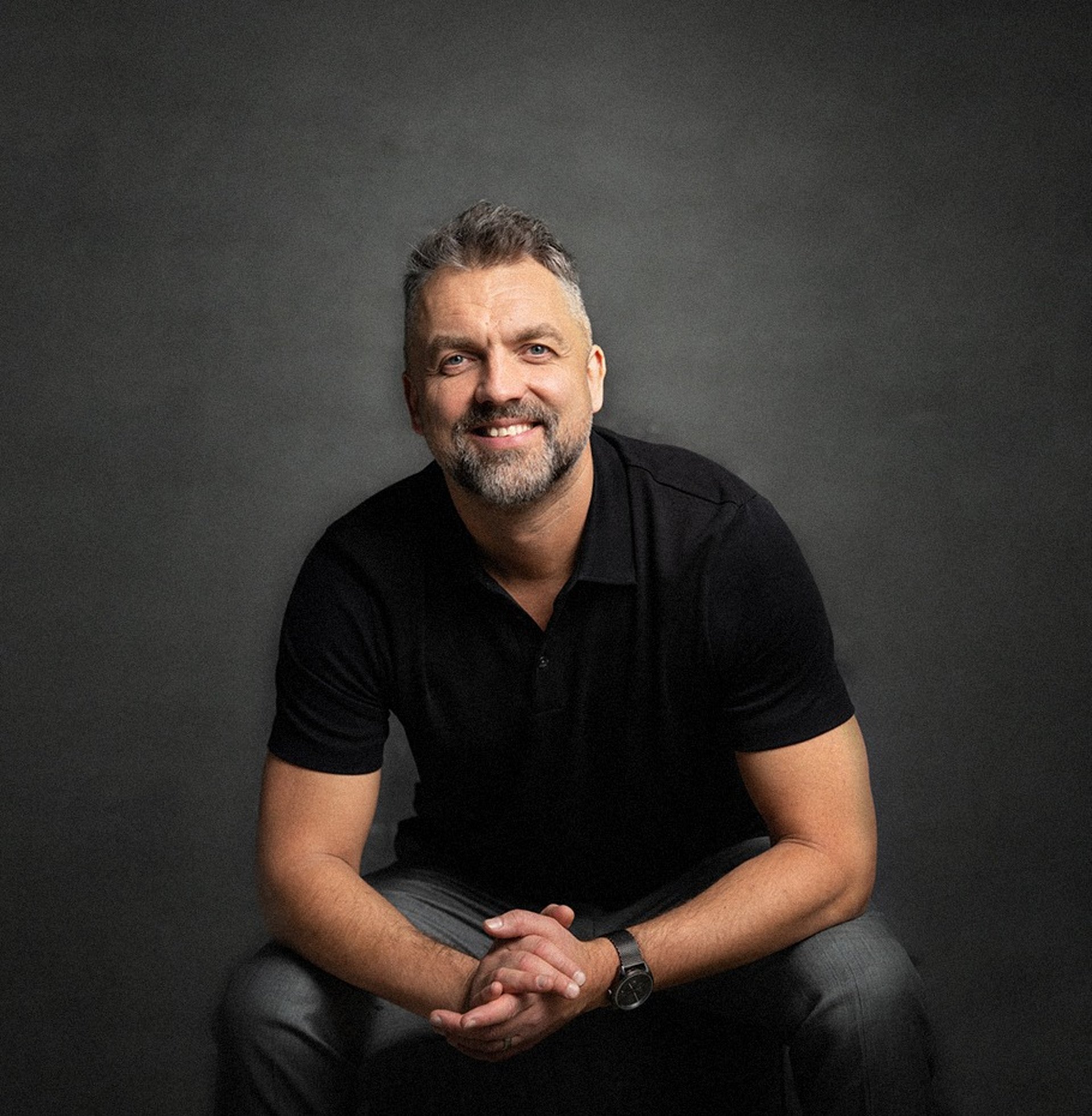 an abstract photo of a curved building with a blue sky in the background