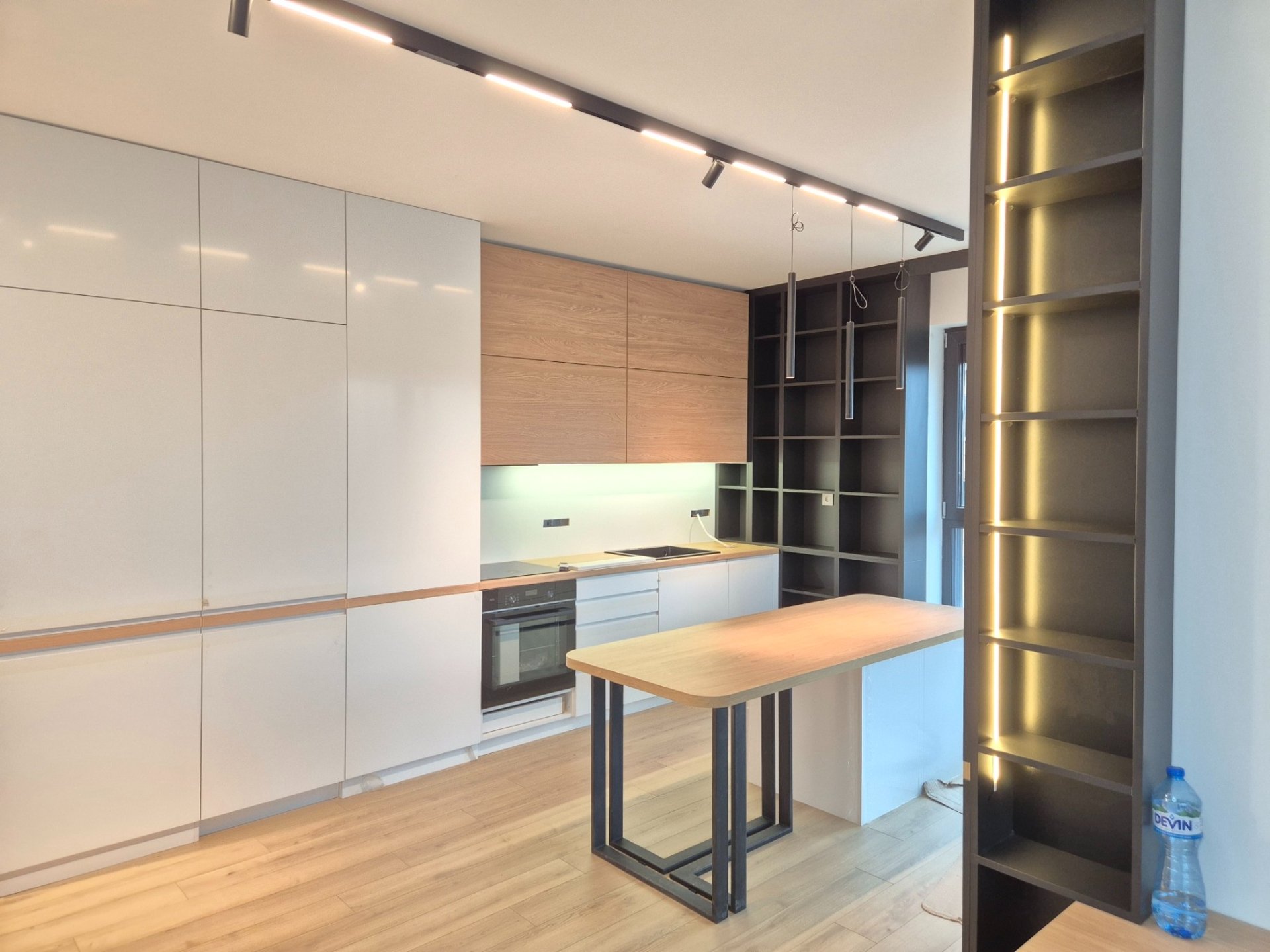 white and brown concrete building near green grass field during daytime